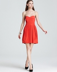 Cut a short and sweet silhouette in this Shoshanna strapless dress, splashed in an eye-catching hue.