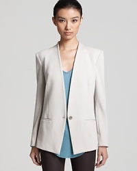 A knit Helmut Lang jacket reinvents the office look for a style that truly boasts your fashion intelligence.