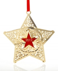 The Macy's star gets a holiday makeover. With a red star at its center and more engraved stars in gold-plated brass, this eye-catching Christmas ornament shines with one-of-a-kind brilliance. By ChemArt.