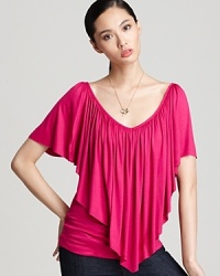 Command the center of attention in this brightly-colored Sweet Pea top that spotlights a dramatic, sweep-front ruffle.