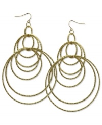 Style that runs circles around the competition. These orbital hoop earrings by GUESS are crafted in gold tone mixed metal. Approximate drop: 4 inches. Approximate diameter: 3 inches.