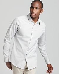 Light gray mini gingham adds a sophisticated accent to a slim fit shirt by Theory.