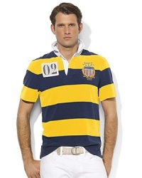 A classic rugby shirt, crafted from cotton jersey, is cut for a trim, modern fit and finished with vibrant stripes and bold country embroidery, celebrating Team USA's participation in the 2012 Olympic Games.