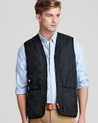 Invest in a trend-right quilted layer to maximize your seasonal style with this sleek zip-front Barbour vest. Zip out liner can be removed for warmer days.