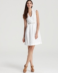 A fanciful eyelet fabric takes to a flirty, feminine silhouette in this kate spade new york dress. A heightened hemline and chic belt add a modern twist to the classic summertime staple.