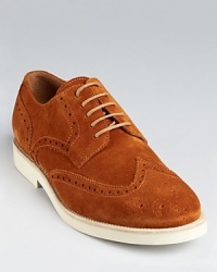 A relaxed but refined wingtip oxford rendered in soft suede.