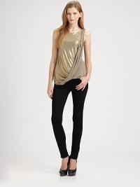 Add a shot of shimmer to any ensemble with this on-trend tank, enhanced by an asymmetrically draped front panel and glimmering goldtone finish. RoundneckSleevelessAsymmetrically draped front panelBody: 95% polyester/5% spandexTrim: 94% rayon/6% spandexDry cleanMade in USAModel shown is 5'10 (177cm) wearing US size Small.This style runs small. We recommend ordering one size up for a standard fit. 