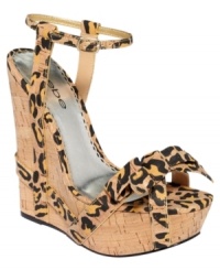 Crazy corks. Bebe's Faithful platform wedge sandals feature a leopard print that runs throughout the upper and the heel alike.