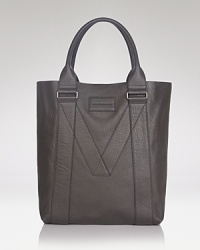 With a signature M deftly patterned into its construction, this tote offers designer appeal in immaculately refined leather. The perfect accompaniment for your travels to and from work and day trips downtown.