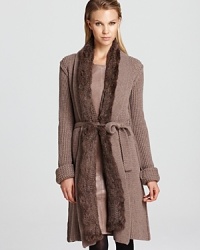 Fall's fur trend is realized with this Armani Collezioni cardigan, rendered in an open silhouette with self-tie fabric belt. Layer the luxe look over chic separates and hit the boutiques in style.