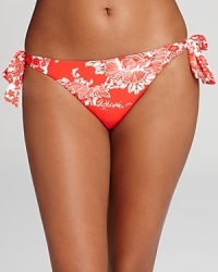 A beautiful floral print defines this brilliantly colored Nanette Lepore bikini bottom-it will lighten up your weekend bag since it reverses to a floral-on-white print for a bit of beachy variety.