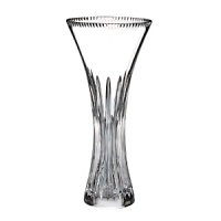 The vertical cuts tracing the neck of this traditional Waterford crystal vase reflect light with singular prismatic opulence.