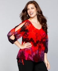 Turn up the heat with INC's plus size top. Split dolman sleeves and a colorful print create an eye-catching combination.