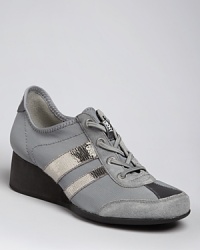 DKNY always delivers looks in step with the athletic trend; these sneakers take things up a notch on wedge heels.