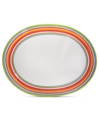 A brilliant line up. The Calypso oval platter brightens every day with hand-painted bands of tropical color in easy-care earthenware. From Clay Art.