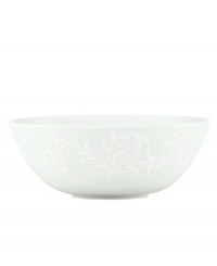 An elegant white-on-white pattern, embossed vine motif and interior glaze adorn this medium serving bowl from Lenox dinnerware. The dishes from the Opal Innocence Carved collection get your table set for refined dining every day.