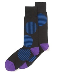 Large dots are striped in alternate directions for an amusing graphic design on these unique socks from Paul Smith.