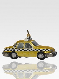 Although the real checker cabs no longer roam the city streets, this sparkling ornament recalls the heyday of these roomy roadsters, crafted of delicate glass with glitter wheels.Handmade and hand-paintedGlassAbout 5L X 2.75H X 2DImported