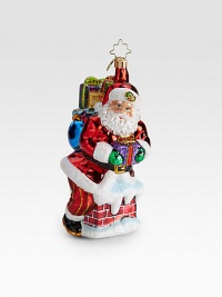 A traditional glass ornament shows Santa and gifts sneaking down the chimney.Hand-blownHand-painted6.5 tallMade in Poland