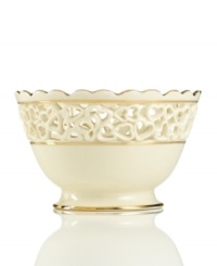 Distinguished by a scalloped edge, bands of gold and heart cutouts in creamy ivory porcelain, this lovely bowl combines traditional style and timeless grace.