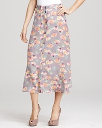 Muted hues and a painterly print impart pared-down glam to this maxi length Tucker skirt. Wear with nude platform pumps and a simple tee for a subtle nod to 1970s style.