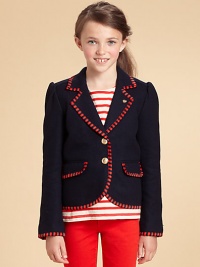 A preppy sailor-style blazer with contrast striped piping and slightly puffed sleeves.Notched collarFront buttonsLong sleevesFlap front pocketsBack tab with buttonsBack ventsFully lined60% wool/40% nylonDry cleanImported Please note: Number of buttons may vary depending on size ordered. 