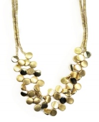 Capture a look that's out of this world. Make a stunning statement in chic, circular style. Necklace by Jones New York features two rows of clustered discs. Setting and chain crafted in worn gold tone mixed metal. Approximate length: 17 inches. Approximate drop: 3 inches.