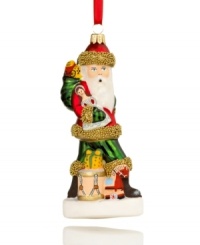 Reminiscent of Vaillancourt's chalkware figurines, this toy-toting Santa ornament accents your tree with distinct vintage style. Hand-painted glass shines with brilliant golden beads.