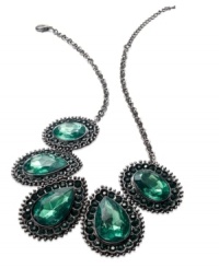 Soothing colors wash over this alluring station necklace from Style&co. The faceted green glass and plastic stones are complemented with dusky hematite hues. Crafted in hematite tone mixed metal. Approximate length: 19 inches + 2-inch extender. Approximate drop: 2 inches.