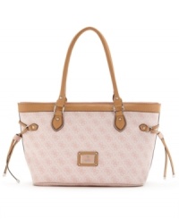 The scandal would be to leave it home! With GUESS's signature quatrefois G monogram print, side drawstrings and a rectangular silhouette that's the right shape for shopping, this chic carryall will be your go-to bag.