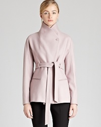 An unmistakably chic funnel neck jacket, crafted from soft brushed wool, flaunts a self-tie belt to define your silhouette. A classic look with feminine flair, this elevated piece is the season's must-have acquisition.