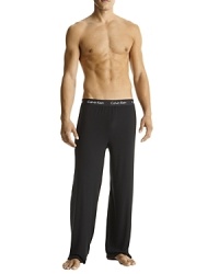 Sexy-fit with contour shapes, soft hand with luxurious drape. Exposed waistband style pajama pants.