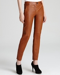 Supple Escada leather pants in a warm cognac hue update your fall wardrobe with uptown sophistication. Wear them with pumps and a blazer to dinner or booties and a tank out dancing.