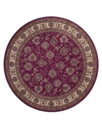 A round rug that is ideal for the center of rooms. Inspired by classic Persian art and culture, this rug features an arresting color palette of burnt red and neutral hues and a beautiful, curvilinear floral pattern. Easy-care polypropylene ensures durability.