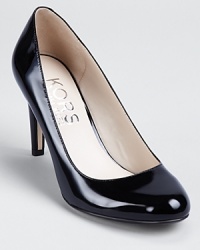 It doesn't get more classic than this--these KORS Michael Kors pumps showcase timeless elegance in slick patent leather.