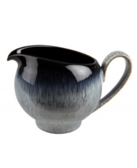 Sturdy and stylish, Denby's Halo gravy boat moves seamlessly from oven to table in contemporary black-and-white stoneware.