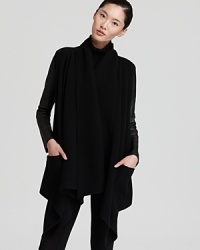 This signature Donna Karan New York cozy is the picture of modernity, rendered in ultra-soft wool and cashmere with supple leather sleeves. Choose it as a chic alternative to a jacket this fall.