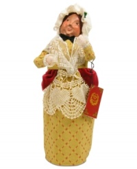 Have a ball with Mrs. Fezziwig! Dickens' cheerful merchant welcomes guests to her annual Christmas party, celebrating with all the employees – even a young Ebenezer Scrooge – in this handcrafted Byers' Choice collectible.