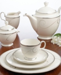 Fluid platinum scrolls glide freely throughout this beautiful fine china mug from Noritake. Easy to match with any decor, the fresh and elegant Platinum Wave collection of dinnerware and dishes is a timeless look for fine dining or luxurious everyday meals. Holds 15 oz.