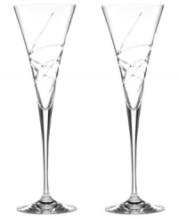 A fanciful cut pattern contrasts the timeless silhouette of Adorn crystal toasting flutes, featuring the exquisite craftsmanship of Lenox.