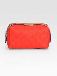 Nylon Guccissima trimmed with leather in a petite zip-top case.Top zip closureFully lined6¼W X 3½H X 3½DMade in Italy