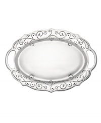 With a feminine edge and pretty perforated detail, the large French Perle handled tray from Lenox's collection of serveware and serving dishes holds roast turkey, grilled fish, or a pile of BLTs with decidedly vintage charm. In pure aluminum, it's a brilliant complement to French Perle dinnerware. (Clearance)