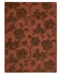 Those with a rosy outlook will embrace the elegant floral motif of this Nourison rug. Hand-tufted from premium-quality wool and meticulously hand-carved for a lush dimensional effect, every detail of this alluring area rug comes together to create a bold focal point in any setting. (Clearance)