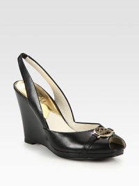 Sleek and comfortable peep toe design of rich leather with an elevated wedge, signature metal logo and elastic slingback. Stacked heel, 3¾ (95mm)Leather upperPeep toeLeather lining and solePadded insoleImported