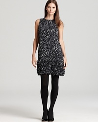 Talk about texture, this MICHAEL Michael kors dress embraces a bold feminine vision as a statement ruffled hem adorns a polka-dot silhouette for festive look ready to light up the room.