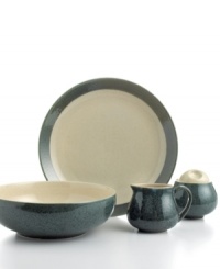 Sango gives casual tables an earthy vibe with this moss and cream Malibu completer set. Hardy stoneware in basic shapes with a unique splattered glaze serves three meals a day with one-of-a-kind style.