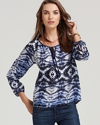 A tie-dye print lends eclectic attitude to this bohemian-chic Velvet by Graham & Spencer top.