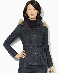 A rugged denim jacket is designed with a detachable faux-fur-trimmed hood and a flattering belted waist.