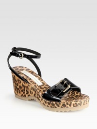 A leopard-print cork wedge adds feline-inspired style to this faux patent design. Cork wedge, 3 (75mm)Cork platform, 1 (25mm)Compares to a 2 heel (50mm)Faux patent leather upperAdjustable strapsFaux leather liningRubber solePadded insoleMade in Spain