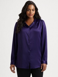 A touch of stretch gives this satin button-down must-wear status. Pair this style with your favorite pants or jeans. Collar neckLong sleevesButton cuffsButton-front styleSolid frontPrinted backBack yokePrincess seams on printed backAbout 28 from shoulder to hemPolyester/elastaneDry cleanImported